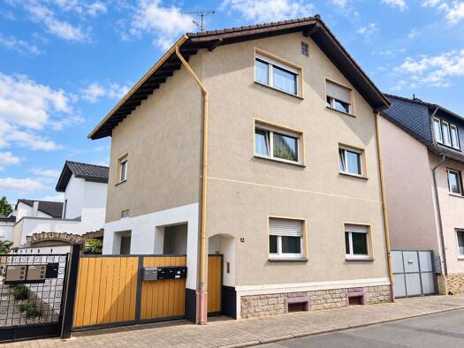 Mehrfamilienhaus zum Kauf als Kapitalanlage geeignet 325.000 € 6 Zimmer 180 m² Bischofsheim 65474