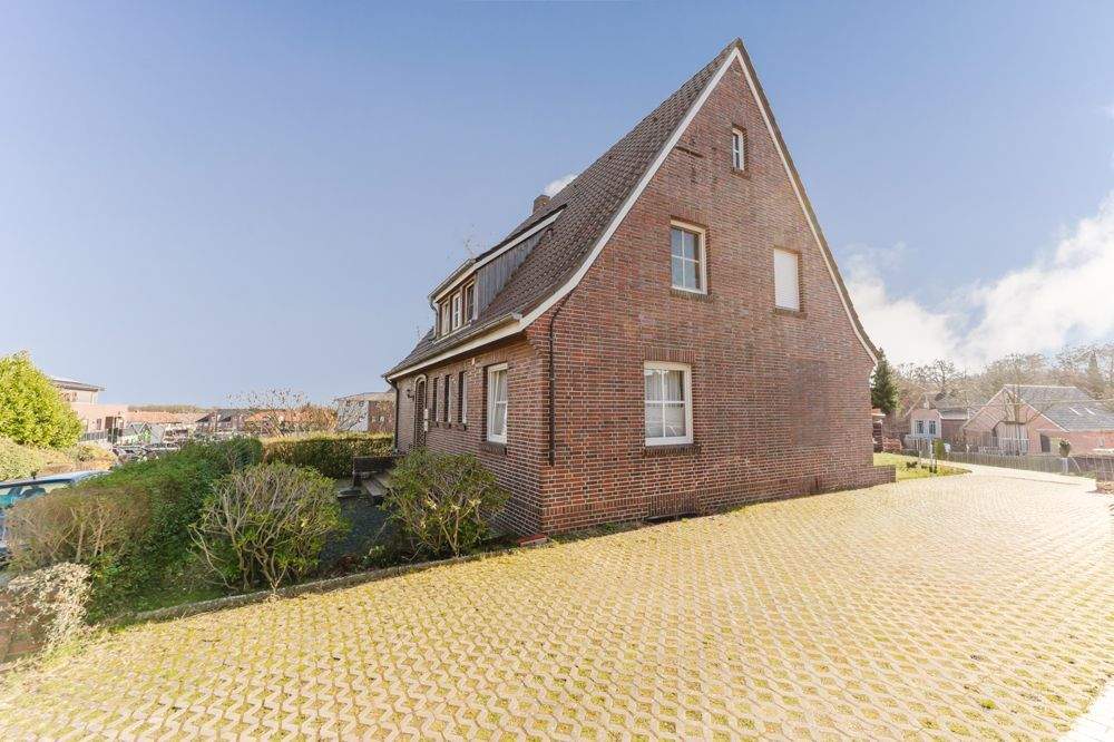 Immobilie in Uelsen - Kapitalanlage in Toplage von Uelsen - Vermietetes Einfamilienhaus mit Einliegerwohnung - Bild 1