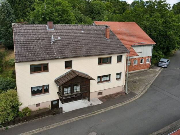 Einfamilienhaus zum Kauf 190.000 € 8 Zimmer 188 m² 3.616 m² Grundstück Holzmühl Freiensteinau 36399