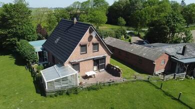 Mehrfamilienhaus zum Kauf 399.000 € 8 Zimmer 165 m² 1.018 m² Grundstück Rüxbüller Straße 3 Tönning / Kating 25832