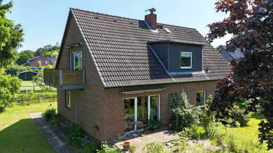 Mehrfamilienhaus zum Kauf 349.000 € 7 Zimmer 166,9 m² 1.055 m² Grundstück Hartenholm 24628