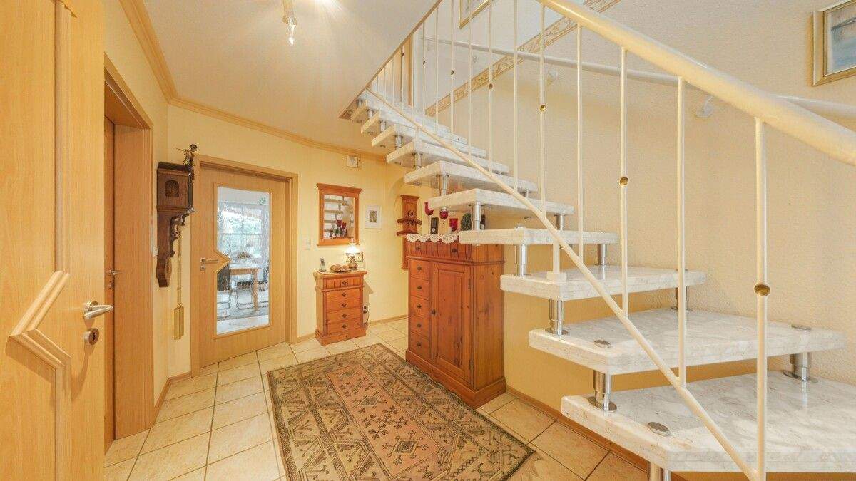 Immobilie in Brinkum - Gepflegtes Einfamilienhaus mit traumhaftem Garten - Bild 1