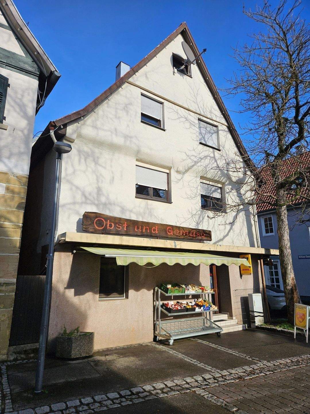 Immobilie in Ditzingen - Mehrfamilienhaus mit zwei Wohnungen und Ladengechäft - Bild 0