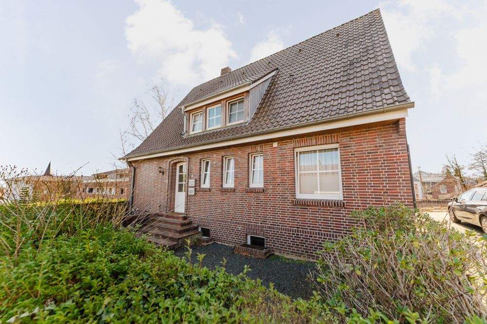 Immobilie in Uelsen - Kapitalanlage in Toplage von Uelsen - Vermietetes Einfamilienhaus mit Einliegerwohnung - Bild 0