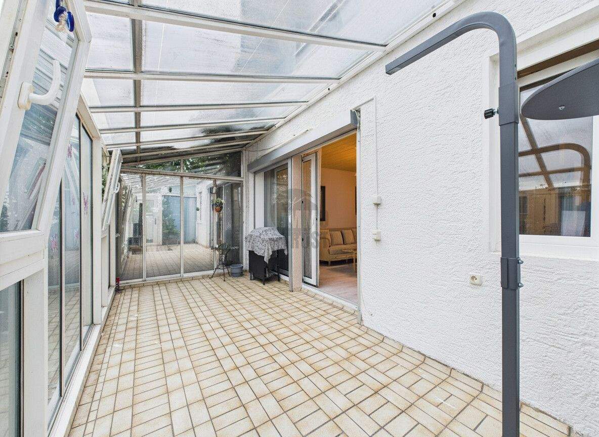 Immobilie in Neu-Ulm - HELL UND RUHIG: HOCHPARTERRE MIT WINTERGARTEN UND GEMEINSCHAFTSGARTEN - Bild 1