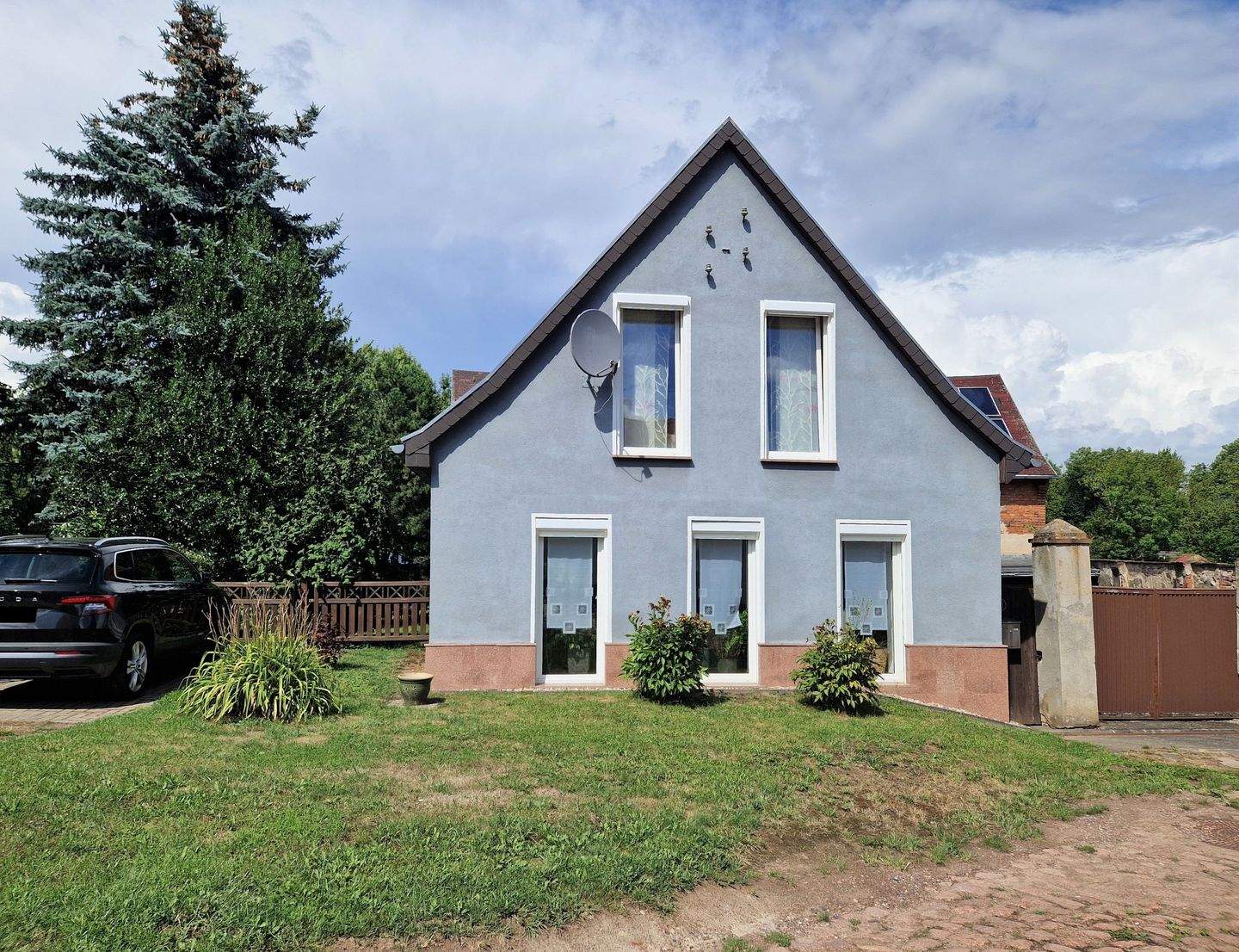 Immobilie in Wettin-Löbejün - Einfamilienhaus mit Nebengelass auf einem großen und von viel Grün umgebenen Grundstück am Ortsrand von Nauendorf - Bild 1