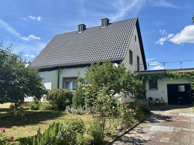 Einfamilienhaus zum Kauf 389.000 € 6 Zimmer 147 m² 1.254 m² Grundstück Donnersdorf 97499
