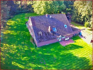 Einfamilienhaus zum Kauf 330.000 € 13 Zimmer 300 m² 5.000 m² Grundstück Middels Aurich 26607