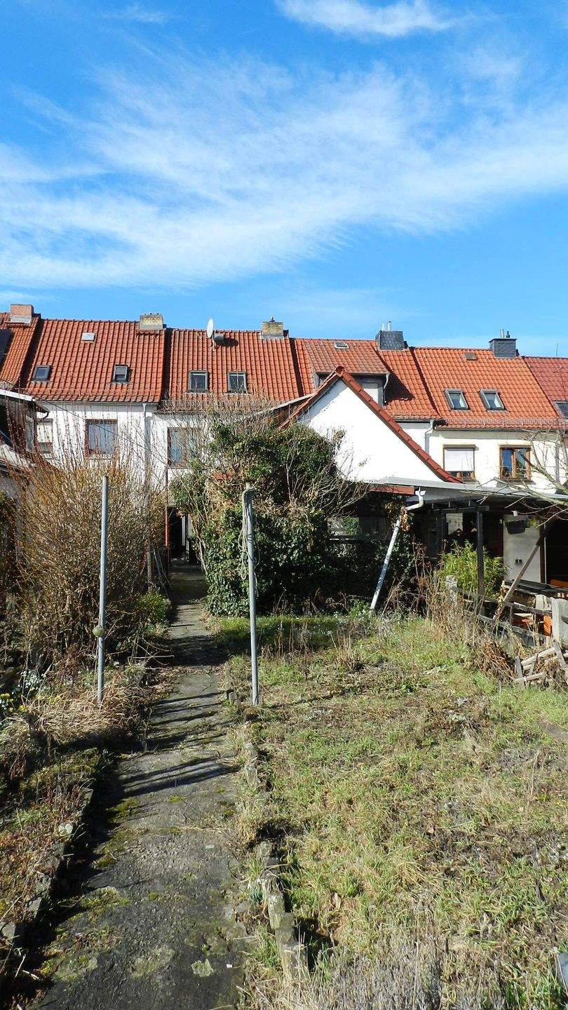 Immobilie in Unterwellenborn - Reihenmittelhaus mit Garage und Nebengelass zu verkaufen - Bild 1