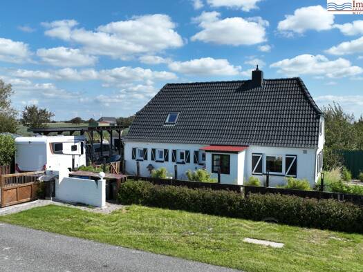 Einfamilienhaus zum Kauf 450.000 € 9 Zimmer 130 m² 1.300 m² Grundstück Friedrichskoog 25718