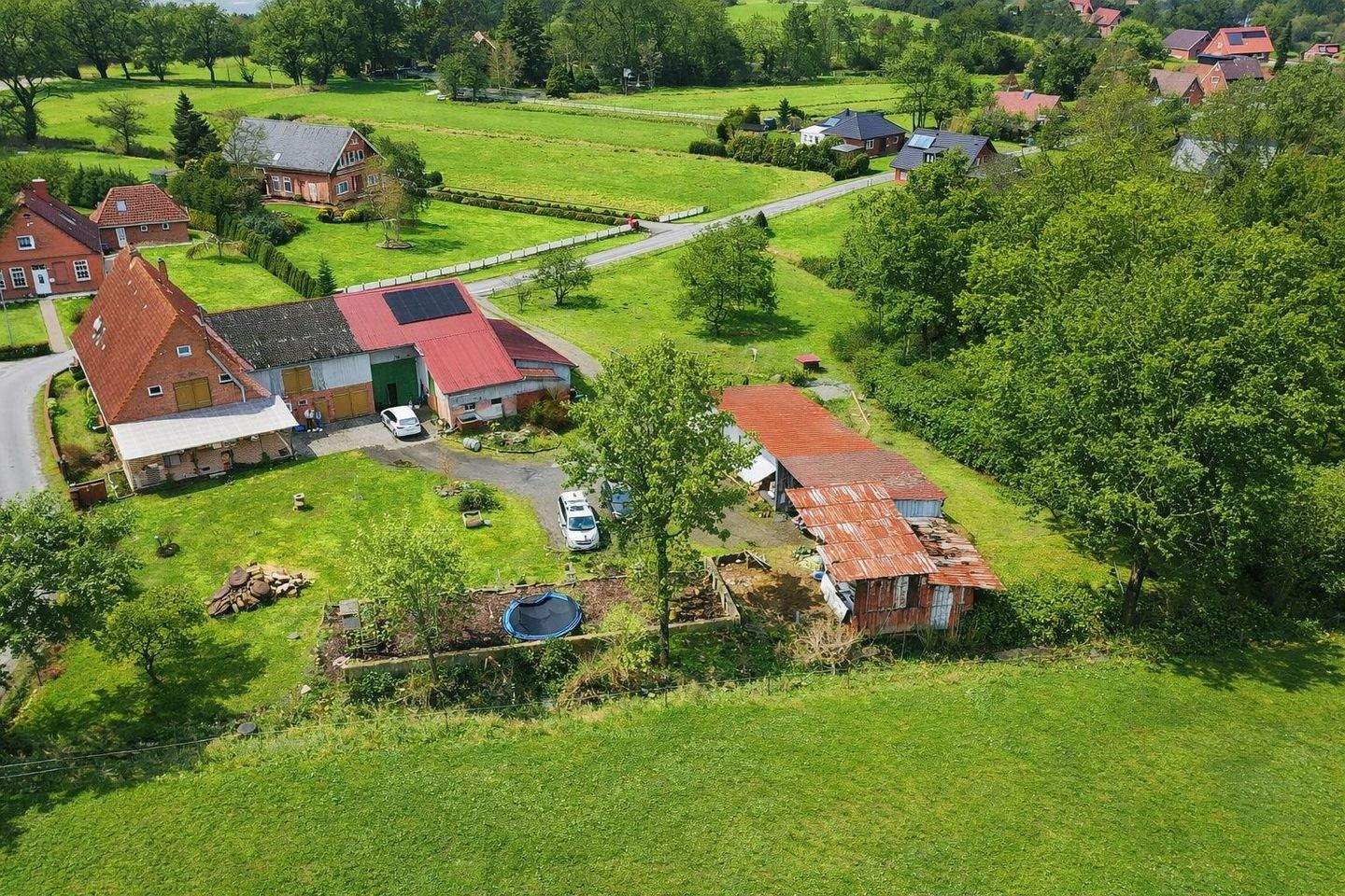 Immobilie in Neuenkirchen - Ländliche Idylle mit Wasserzugang: Charmanter Resthof mit Ferienwohnung und weitläufigem Grundstück - Bild 1