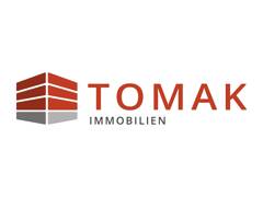 Tomak Immobilien logo