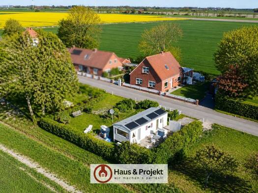 Einfamilienhaus zum Kauf 235.000 € 5 Zimmer 138 m² 744 m² Grundstück Wirdum Wirdum 26529