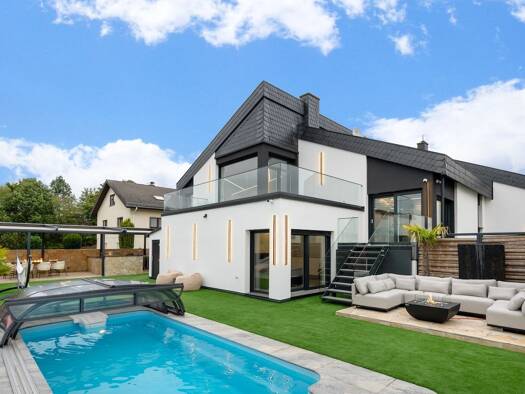 Einfamilienhaus zum Kauf 2.199.000 € 10 Zimmer 385,2 m² 855 m² Grundstück Rodheim-Bieber Biebertal 35444