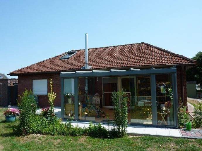 Immobilie in Thomasburg - Barrierefreier Bungalow mit Wintergarten und Kaminofen - Bild 0