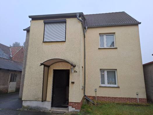 Einfamilienhaus zum Kauf 49.900 € 8 Zimmer 127 m² 2.290 m² Grundstück Krina Muldestausee 06774