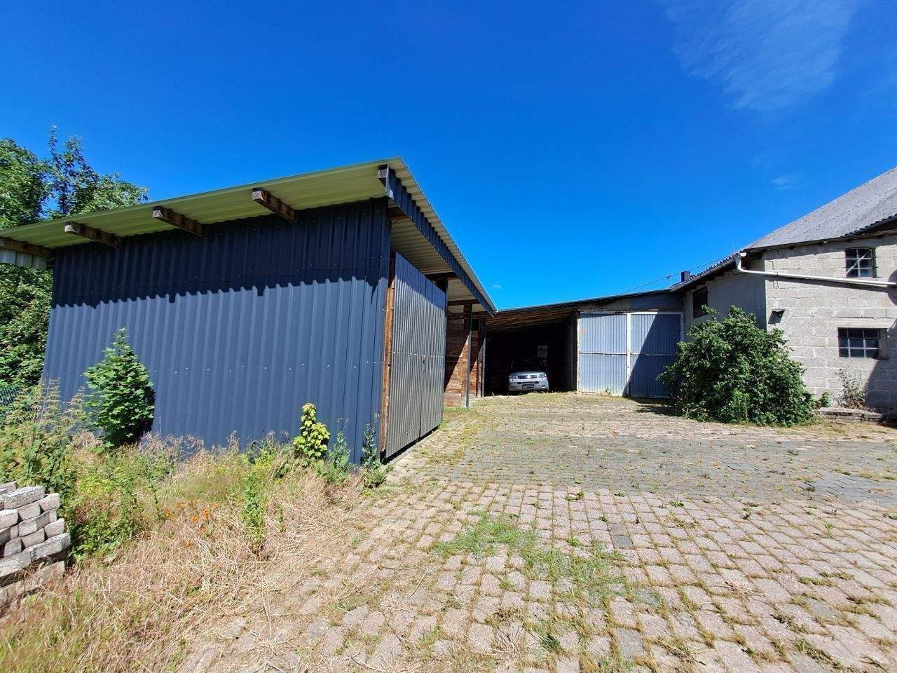 Immobilie in Schechingen - Zweifamilienhaus mit Nahwärme, Carport und Scheune – viel Platz für Wohnen & Hobby - Bild 2